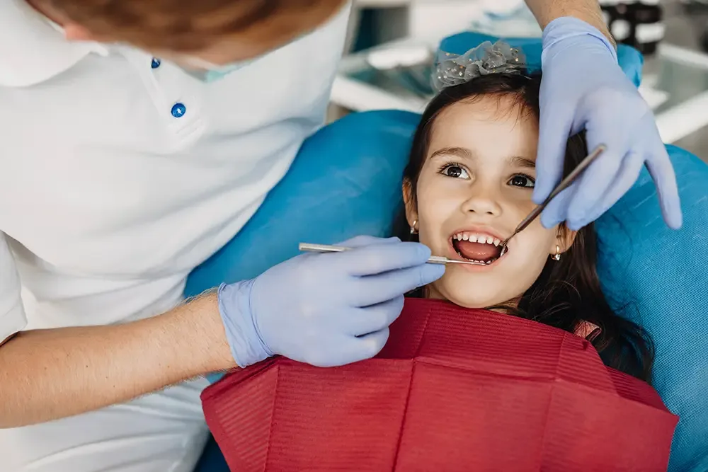 Young patient smiling in dental chair