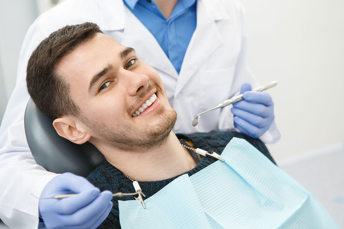 Patient in dental chair during crown procedure
