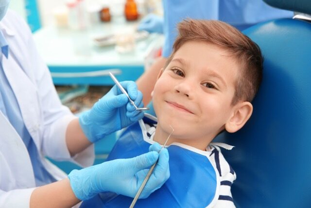 Child smiling at dental visit